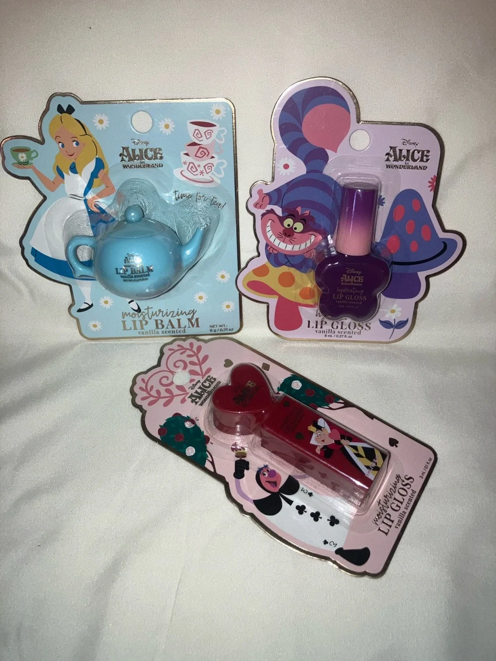 Disney Alice in Wonderland Blue Teapot Lip Balm and Chessire Cat Lip Gloss Set